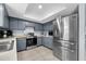 Well-equipped kitchen featuring stainless steel appliances, ample cabinet space, and tile flooring at 4076 Vana Dr, Sarasota, FL 34241