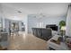 Open living room with tile floors, ceiling fan, and dining area with natural light at 4076 Vana Dr, Sarasota, FL 34241