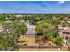 Aerial view of home with a large backyard and mature trees at 4155 Center Gate Blvd, Sarasota, FL 34233