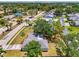A home with a beautiful landscape, swimming pool and tile roof and surrounded by lush trees at 4155 Center Gate Blvd, Sarasota, FL 34233
