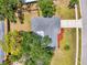 Aerial view of the property showing the roof, driveway, landscaping and the surrounding neighborhood at 4155 Center Gate Blvd, Sarasota, FL 34233
