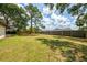 Lush, expansive backyard features a privacy fence and mature trees at 4155 Center Gate Blvd, Sarasota, FL 34233