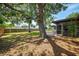 Expansive backyard with mature trees, a swing, and a privacy fence at 4155 Center Gate Blvd, Sarasota, FL 34233