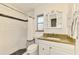 Updated bathroom with modern fixtures, granite counters, and tiled shower at 4155 Center Gate Blvd, Sarasota, FL 34233