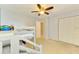 Bedroom with bunk beds, ceiling fan, carpeted floors, and closet space at 4155 Center Gate Blvd, Sarasota, FL 34233