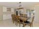 Comfortable dining area with a wooden table that seats six and sliding glass doors at 4155 Center Gate Blvd, Sarasota, FL 34233