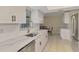 Modern kitchen featuring white cabinets, stainless steel appliances, and marble countertops at 4155 Center Gate Blvd, Sarasota, FL 34233