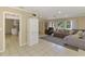 Open-concept living area with tiled flooring, views to other rooms, and lots of natural light at 4155 Center Gate Blvd, Sarasota, FL 34233