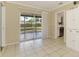 Bright living area with tiled floors, sliding glass doors, and a view of the backyard at 4155 Center Gate Blvd, Sarasota, FL 34233