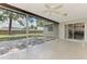 Covered patio with tile flooring and a screened-in area for relaxing outdoors at 4155 Center Gate Blvd, Sarasota, FL 34233