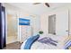 Cozy bedroom featuring a TV, closet, hardwood floors, and an en-suite bathroom at 4430 Pond Brook Ct, Bradenton, FL 34211