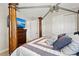 Bedroom with a four-poster bed, tv, and ample closet space at 4430 Pond Brook Ct, Bradenton, FL 34211
