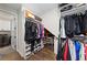 Walk-in closet with custom shelving and hanging rods for ample storage of clothes and shoes at 4430 Pond Brook Ct, Bradenton, FL 34211