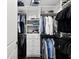 Organized walk-in closet with built-in shelving and drawers to maximize storage space at 4430 Pond Brook Ct, Bradenton, FL 34211