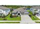 Charming single-Gathering home featuring a stone facade, well-manicured lawn, and a two-car garage at 4430 Pond Brook Ct, Bradenton, FL 34211