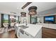 Open-concept kitchen featuring a large island with a sink and views into the dining and living areas at 4430 Pond Brook Ct, Bradenton, FL 34211