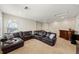 Cozy living room featuring a sectional couch, wet bar, and plenty of space for entertaining at 4430 Pond Brook Ct, Bradenton, FL 34211