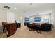 Spacious living room features stylish wet bar, plush seating, and modern entertainment setup at 4430 Pond Brook Ct, Bradenton, FL 34211