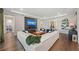 Spacious living room with fireplace, large white sectional, modern decor, and views into other living spaces at 4430 Pond Brook Ct, Bradenton, FL 34211