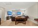Spacious living room with two TVs, comfortable seating, and a decorative table at 4430 Pond Brook Ct, Bradenton, FL 34211