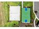 Aerial view featuring a sand volleyball court, basketball court, and sidewalk trail at 4430 Pond Brook Ct, Bradenton, FL 34211