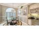 Bright breakfast nook with a glass table and a charming chandelier at 4612 4Th E Ave, Bradenton, FL 34208