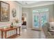Welcoming foyer featuring a console table and views of the bedroom and outdoor patio at 4612 4Th E Ave, Bradenton, FL 34208