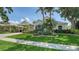 Inviting home exterior with lush greenery, manicured lawn, and architectural details, highlighting the curb appeal at 4612 4Th E Ave, Bradenton, FL 34208