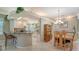 Open floor plan with granite bar that connects the kitchen and dining room at 4612 4Th E Ave, Bradenton, FL 34208