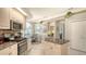 Kitchen with granite countertops, stainless steel appliances, and white cabinetry at 4612 4Th E Ave, Bradenton, FL 34208