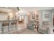 Open-concept living room featuring counter seating, dining area, and comfortable seating arrangement at 4612 4Th E Ave, Bradenton, FL 34208