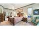 Cozy main bedroom featuring a decorative headboard and soft, natural lighting at 4612 4Th E Ave, Bradenton, FL 34208