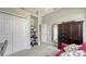 Office space featuring a built-in desk, closet space, and a view into the hallway at 4612 4Th E Ave, Bradenton, FL 34208
