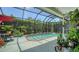 Inviting screened pool area with lush landscaping providing privacy and a relaxing atmosphere at 4612 4Th E Ave, Bradenton, FL 34208