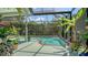 Enclosed pool area surrounded by lush tropical plants creating a serene and private outdoor space at 4612 4Th E Ave, Bradenton, FL 34208