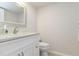 Bathroom features a toilet, sleek countertops, and modern fixtures at 4629 Whirlaway Dr # B, Sarasota, FL 34233