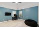 Bedroom featuring wood floors, a ceiling fan, and natural light at 4629 Whirlaway Dr # B, Sarasota, FL 34233