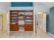 Stylish bedroom with built-in shelving and desk area, and an open doorway at 4629 Whirlaway Dr # B, Sarasota, FL 34233