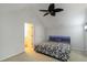 Bedroom features neutral colors, a ceiling fan, and a modern bed at 4629 Whirlaway Dr # B, Sarasota, FL 34233