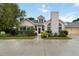 Charming home featuring arched windows, a well-manicured lawn, and a two-car garage at 4629 Whirlaway Dr # B, Sarasota, FL 34233