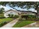 Charming single-story home surrounded by lush landscaping and a walkway leading to the front door at 4629 Whirlaway Dr # B, Sarasota, FL 34233