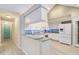 Bright kitchen with granite countertops, stainless steel appliances, and ample cabinet space at 4629 Whirlaway Dr # B, Sarasota, FL 34233