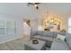 Open living room with vaulted ceiling, modern sofa, and staircase access at 4629 Whirlaway Dr # B, Sarasota, FL 34233