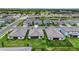 Aerial shot showcasing the home, well-kept lawns, and the surrounding neighborhood with a lake at 4971 Oyster Pearl St, Bradenton, FL 34211