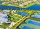 Aerial view highlighting community amenities, including a pool, playground, sports courts, and clubhouse at 4971 Oyster Pearl St, Bradenton, FL 34211