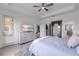 Spacious bedroom with access to the patio, a walk-in closet, and an ensuite bathroom at 4971 Oyster Pearl St, Bradenton, FL 34211