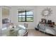 Bright dining area with a glass table and views of the lake through a large window at 4971 Oyster Pearl St, Bradenton, FL 34211
