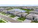 Lovely exterior elevation of a home with a three-car garage, well-kept lawn, and attractive landscaping at 4971 Oyster Pearl St, Bradenton, FL 34211