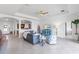 Bright living room features a tray ceiling, tile floors, and archways to other spaces at 4971 Oyster Pearl St, Bradenton, FL 34211