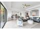 Spacious living room featuring tile floors, stylish furnishings, and an open layout to the kitchen at 4971 Oyster Pearl St, Bradenton, FL 34211